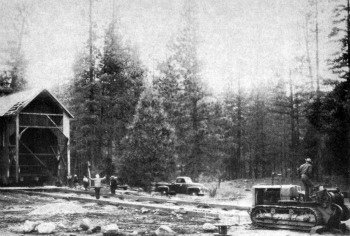 Covered bridge. The old covered bridge moved smoothly ashore.