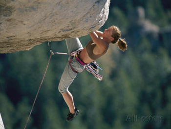 A woman climber negotiates an overhang. Bobbie Model AllPosters.com