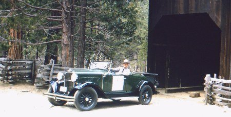 Ranger Norm Bishop drives acroos the Wawona Covered Bridge